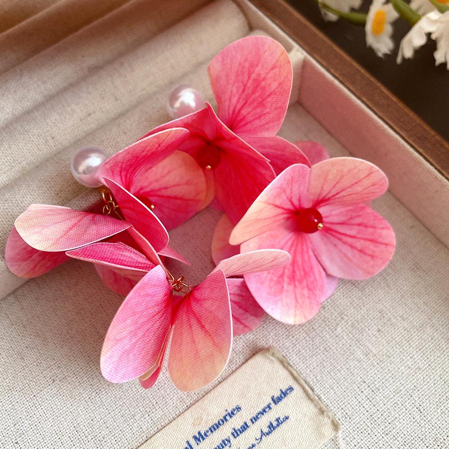 

Seaside vacation wind silver needle pearl flower fringed earrings light luxury high-end earrings sweet small fresh earrings women