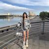 American-Style Oversized Off-Shoulder Sweater: Letter Print, Long Sleeve, Casual Loose Fit for Women In Early Autumn.