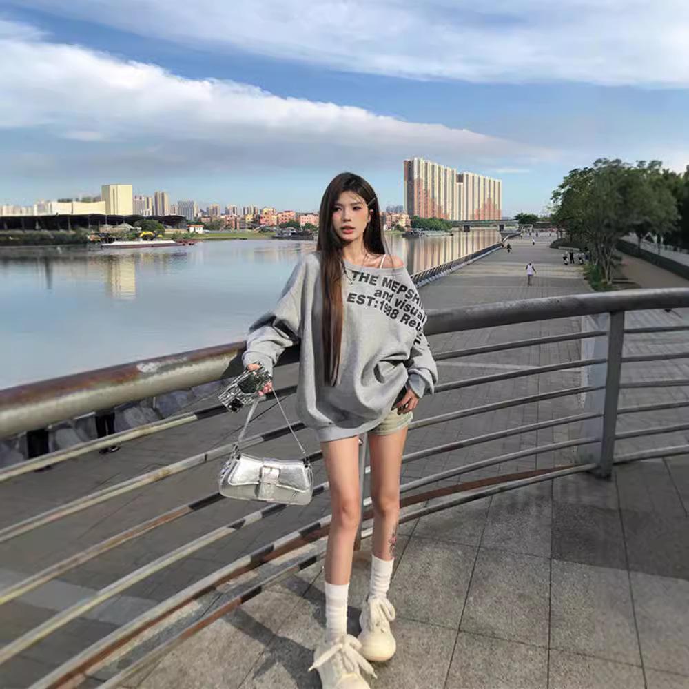 American-Style Oversized Off-Shoulder Sweater: Letter Print, Long Sleeve, Casual Loose Fit for Women In Early Autumn.