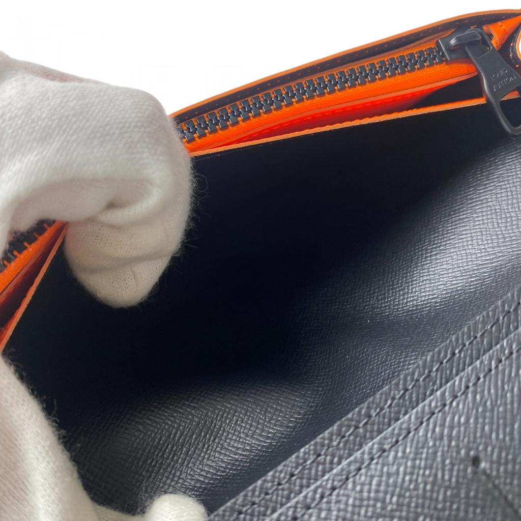 Używany portfel LOUIS VUITTON Seria Brązowo/Pomarańczowa PVC męski