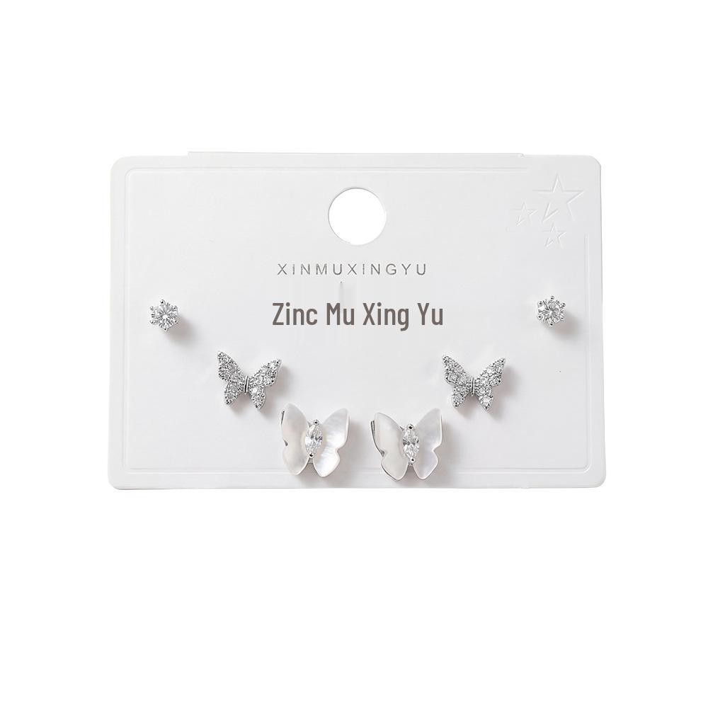 Set of 3 Full-Drilled White Flower Stud Earrings with Micro-Paved Cubic Zirconia and Versatile Silver Needle Design.