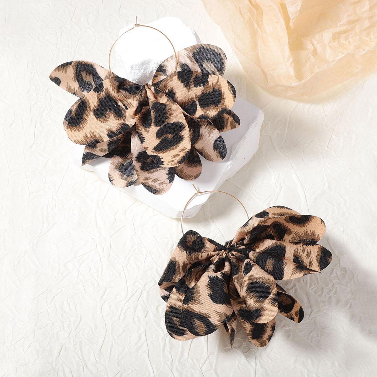 

The Maillard fashion style leopard print fabric exaggerated large flower bow ear rings and earrings are unique, trendy and versatile