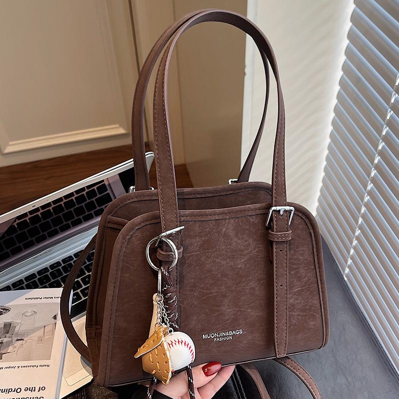 Korean version of high-value niche shoulder bag 2025 autumn new solid color fashion trend glossy underarm handbag women