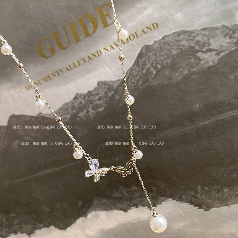 Hollow double butterfly duplex fringed necklace light luxury niche design pearl collarbone chain on the run princess girl