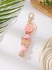 Silicone Beaded Keychain with Daisy, Wooden Butterfly Bracelet & Tassel Pendant