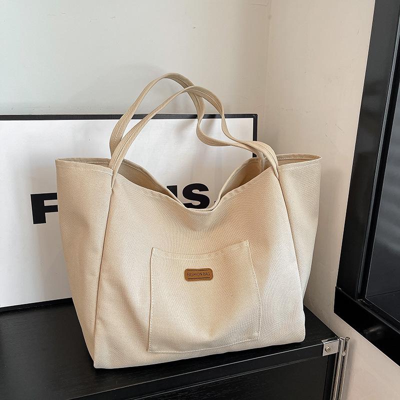 Casual large-capacity canvas bag women's bag 2025 new solid color simple tote bag fashionable shoulder armpit bag