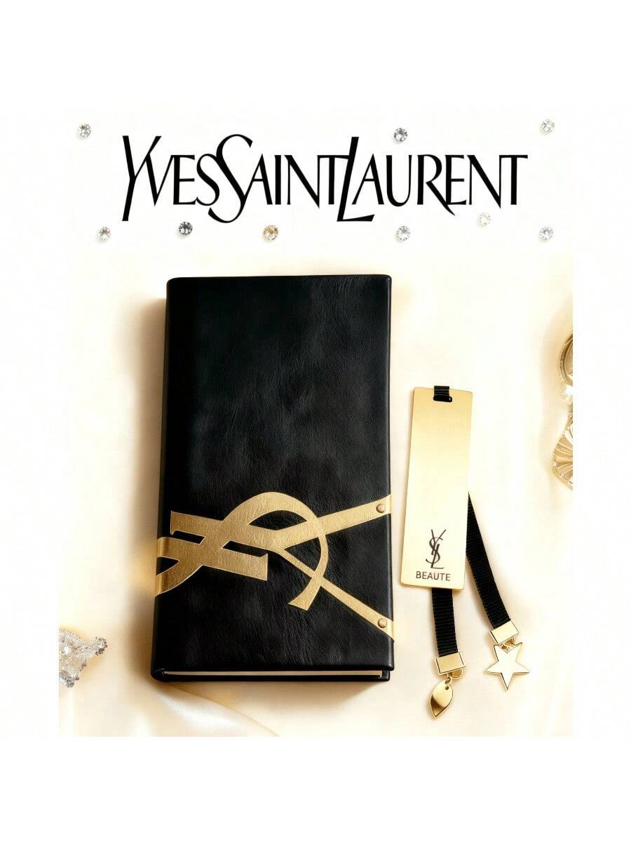 

Висококласний чорний блокнот YSL, з металевою закладкою з текстурою золотистого відтінку та підвісками у формі зірки та серця – стильний аксесуар. золотий/чорний