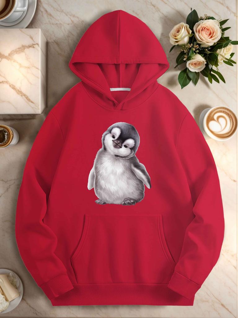 Adorable penguin chick with curious expression women's hoodies