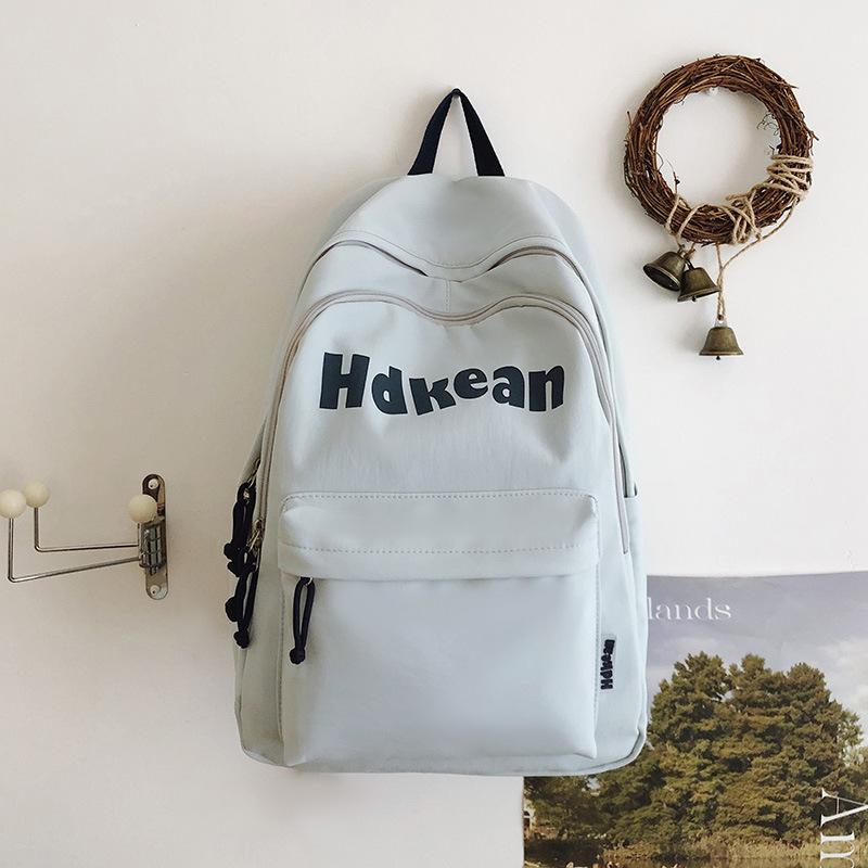New High-value Solid Color Simple Letter Backpack Couple Casual Lightweight Large-capacity Backpack