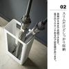 Slim, thin, Scandinavian-inspired umbrella stand for entryways. Tower design, simple, available in white and black. Yamazaki Industries (white).