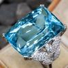 Huitan Luxuriöser Hellblauer Zirkonia-Ring für Damen Modische Weibliche Jubiläumsparty-Accessoires Silbern Farbe Schmuck GeschenkGutes Produkt