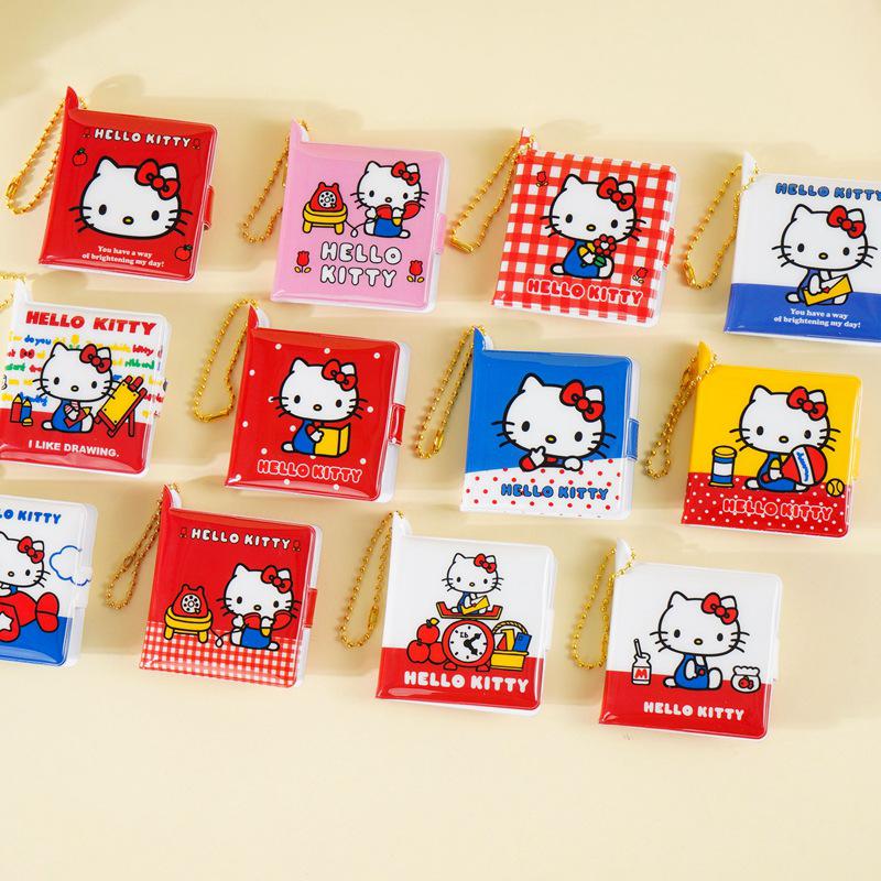 Блокнот на кнопке-застежке Hello Kitty с чистыми листами и подвеской.