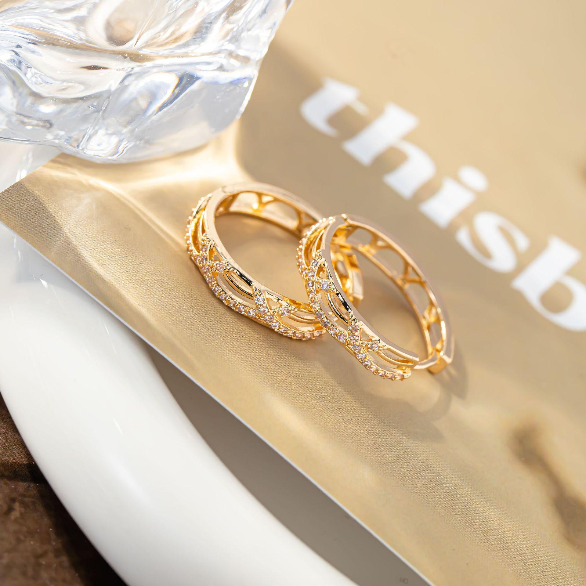 International Fashion Hollow Classic Cross Line Hoop Earrings with Micro-set Diamonds - Asymmetrical and Versatile Trend Earrings.
