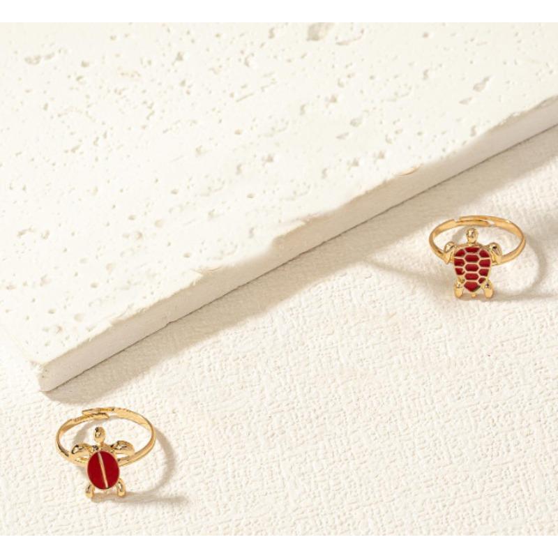

Set of two cute turtles stacked with rings plated with 1k gold design sense versatile summer vacation rings niche rings for men and women червоний