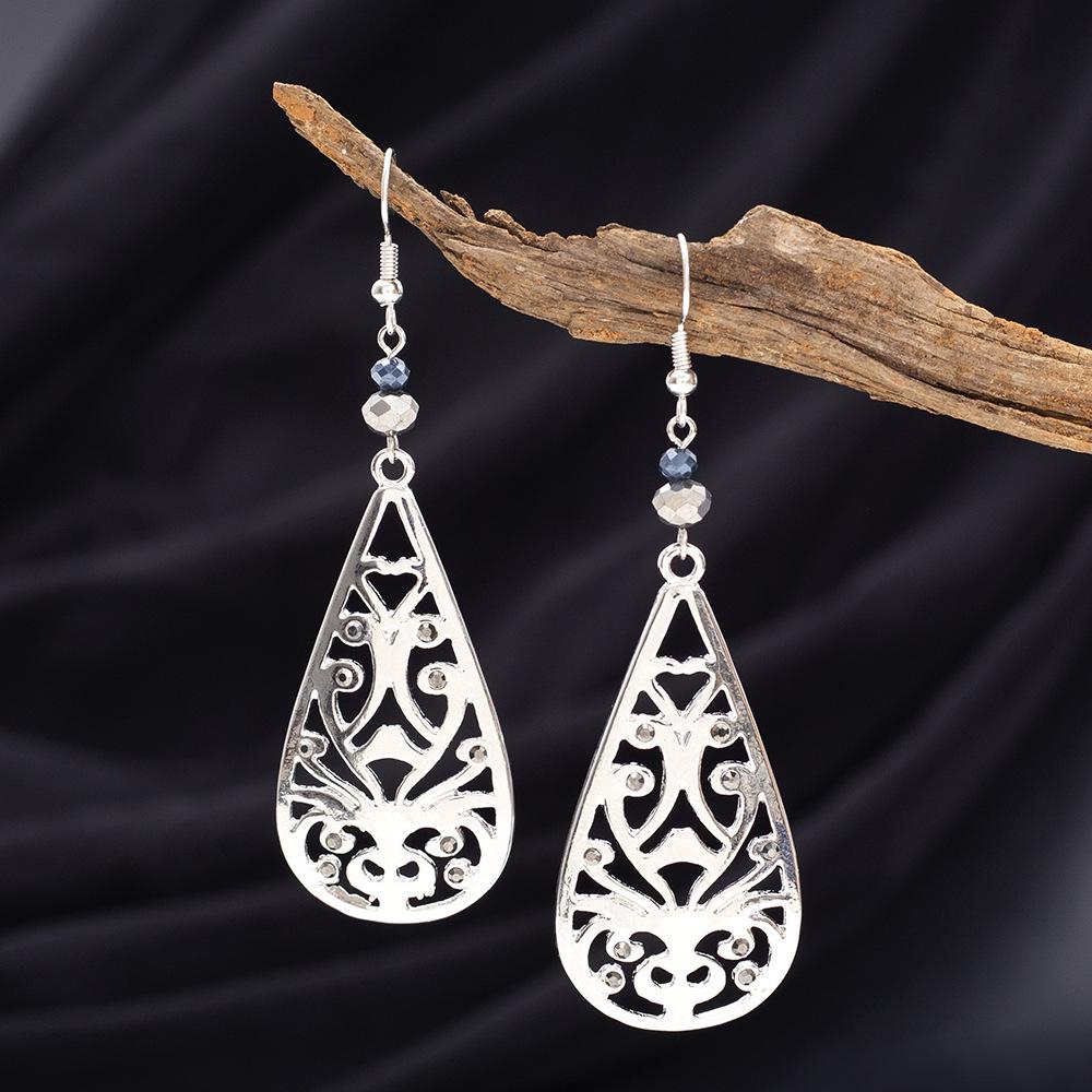Retro Teardrop Earrings with Hollow Floral Design and Rhinestone Accents