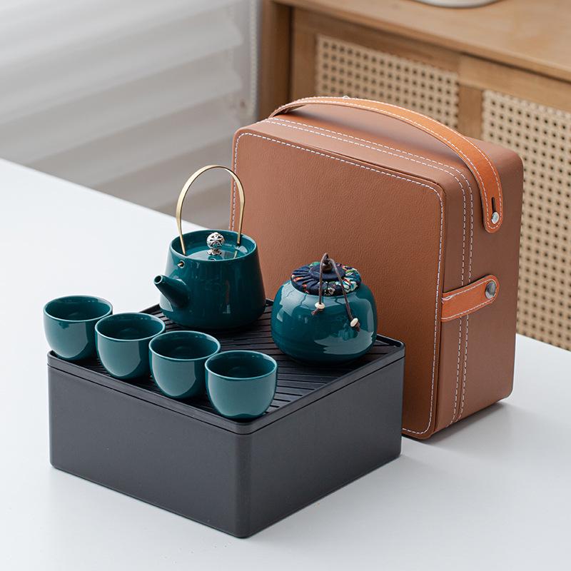 Portable Ceramic Kung Fu Tea Set: Teapot with Handle and Four Cups for Travel and Business Gifting