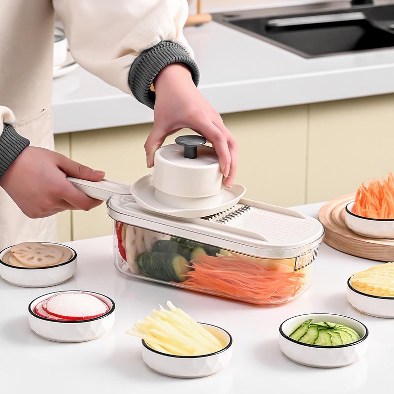 Multifunktioneller Küchenschneider: Gemüse- & Kartoffelschneider mit Julienne-Reibe und Handschutz.