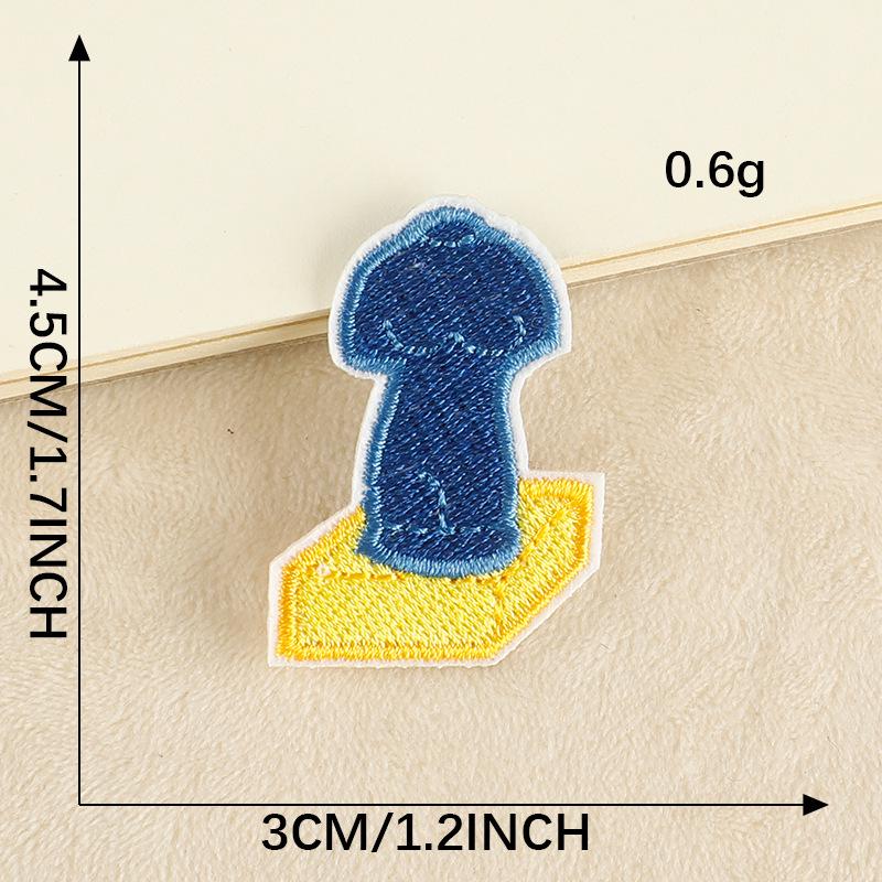 Kreslená oční náplast a vyšívaný odznak na oblečení