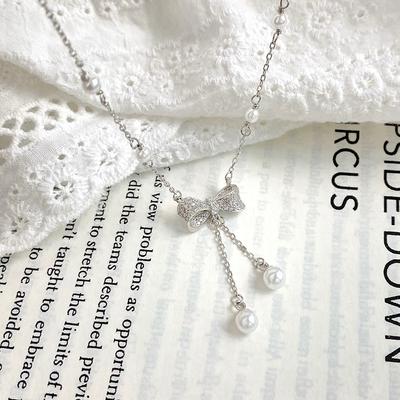 Collier de perles de luxe léger avec nœud papillon pour la conception des minorités féminines, chaîne de clavicule élégante et élégante