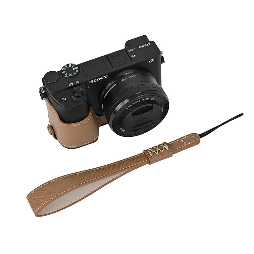 PU kožené pouzdro na polovinu těla fotoaparátu s potiskem dlaně pro Sony A6400 A6300 A6000 A6100, spodní kryt s otvorem na baterii a popruhem na ruku