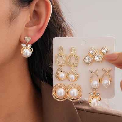 Twelve-piece Set of Diamond-encrusted Imitation Pearl Bow Silver Needle European and American Retro Light Luxury Earrings and Earrings.