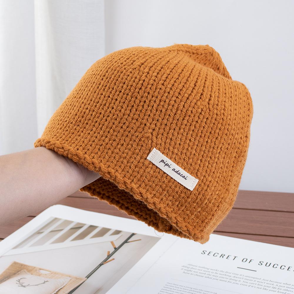 Simple solid color knitted bag head stacking hat women's early autumn new plain and versatile big head circumference showing face small wool hat