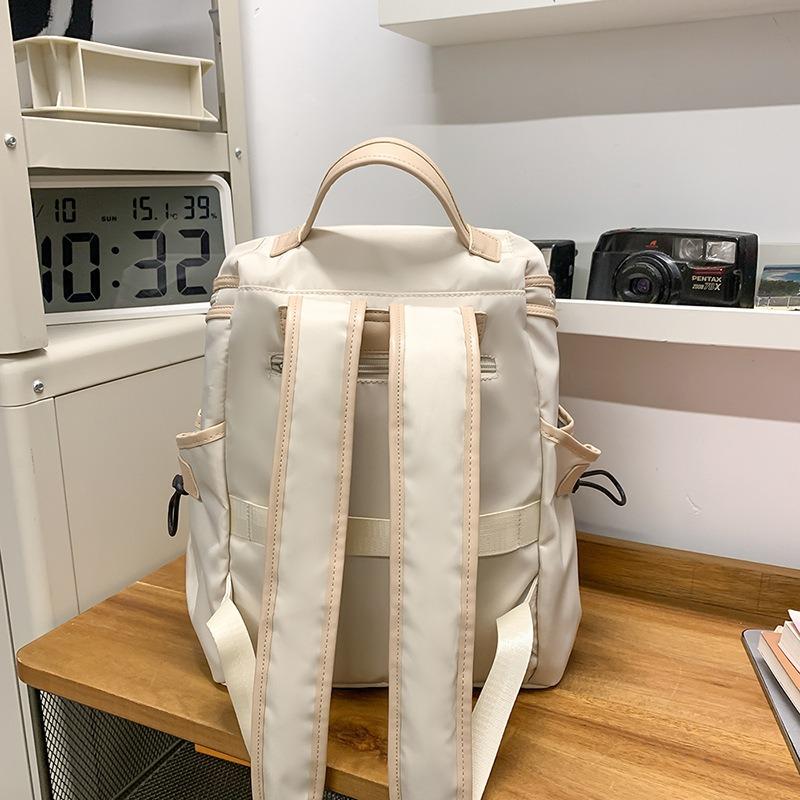 Neuer lässiger vielseitiger Rucksack mit großer Kapazität, leichter und modischer Pendler-Reiserucksack, Nischen-Einfarb-Schulranzen