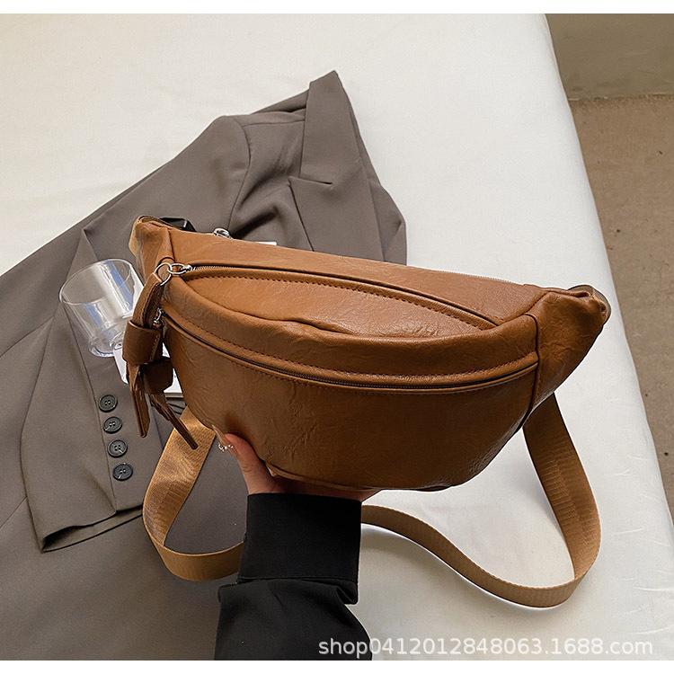 2025 new personalized foreign style women's small breast bag casual simple solid color wide shoulder strap waist bag single shoulder messenger bag wom