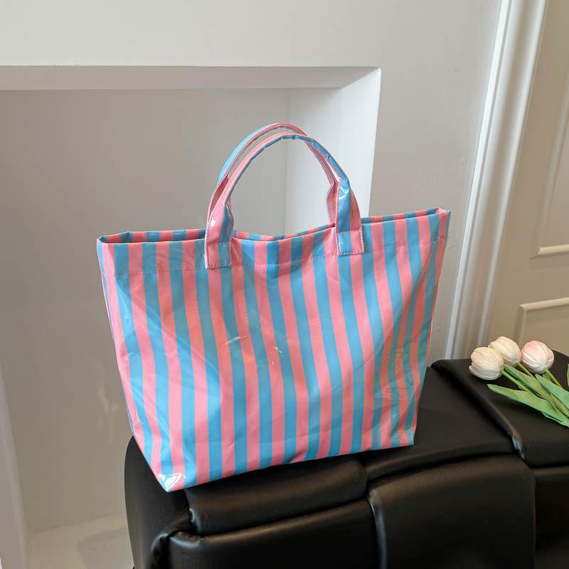 This Water-Resistant Pvc Tote Bag Features A Pink And Blue Striped Design, A Large Capacity, And Is Suitable For Beach Shopping,