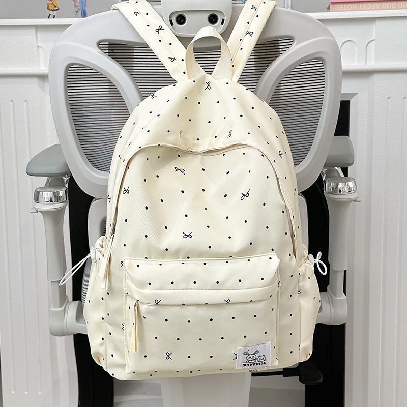 Polka Dot Bow Backpack for Teen Girls: Stylish and Versatile Schoolbag for Middle and High School Students.