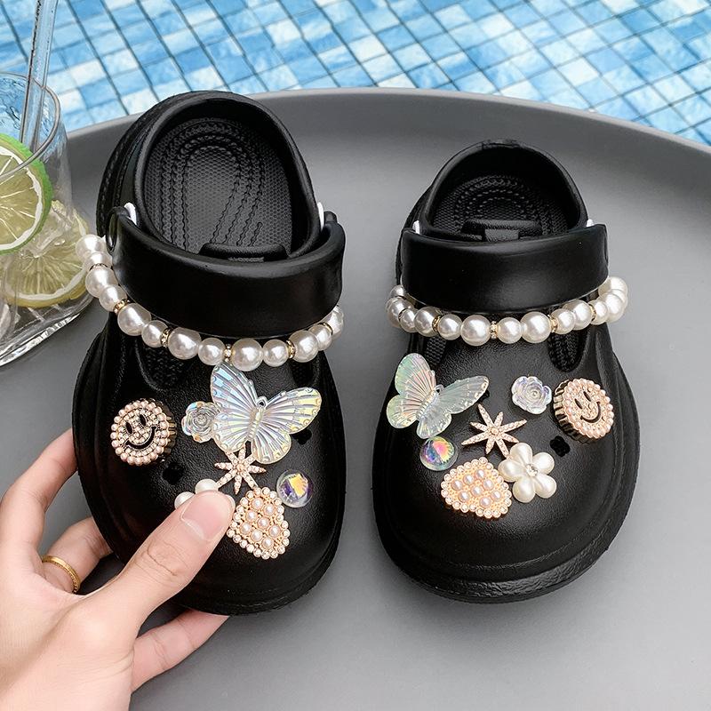 

Exquisite pearl butterfly hole shoes children s summer fashion Korean version gentle thick-soled cool slippers outer bag head slippers 24-25