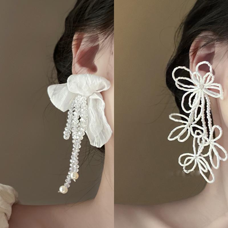 Silver Needle White Heart Tassel Earrings: Luxurious, Versatile, and Stylish Stud Earrings for Women.