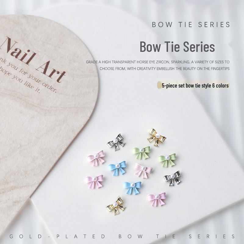 

Nail Art Accessories: Pearl and Metal 3D Bow & Butterfly Rhinestones (5 Pieces)