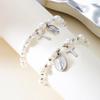 Elegante Bracciale con Crocifisso e Perle, dal Design Unico con Ciondolo in Lega per un Look Raffinato in Diverse Occasioni