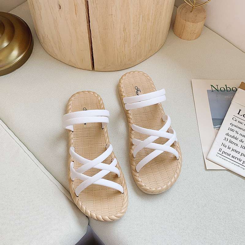 Cool slippers women's new summer fashion versatile flat-bottomed Korean version two wearing Roman sandals thick-soled beach women