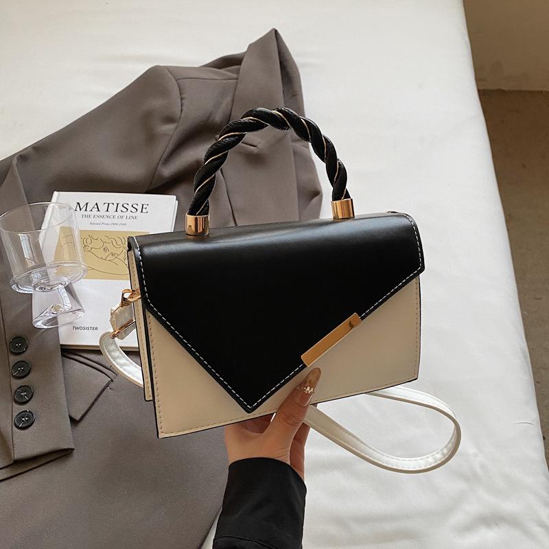 

Simple temperament trend niche contrasting color small square bag women s fashion spring new foreign style texture high-end messenger bag чёрный
