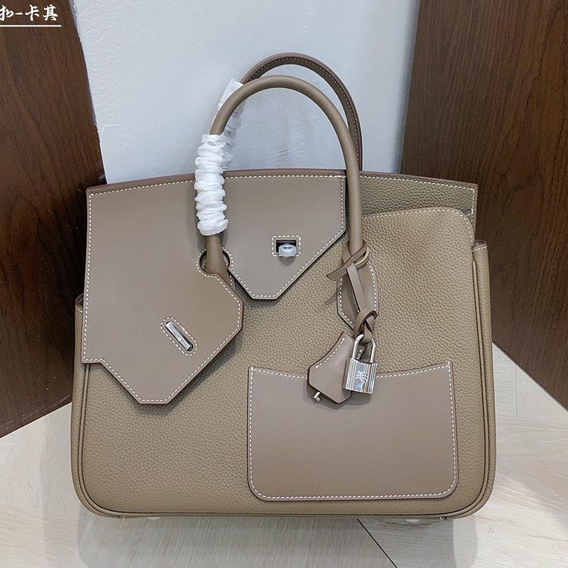 

2025 Новый стиль Кожаная сумка на молнии 30 см Двусторонняя Неправильной формы Натуральная кожа Женская сумка Высококачественная на ощупь Верхняя ручка Сумка-сачель 30x25x12cm