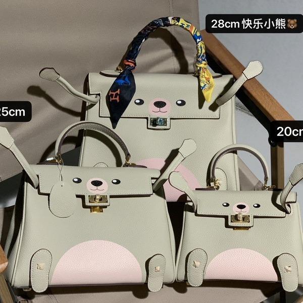 New Genuine Leather Women's Bag Head Layer Leather TOGO Leather Shattered Dimension Cartoon Graffiti Smiling Face Doll Women's Bag