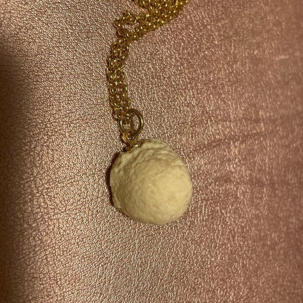 Used Q-POt banana chocolate necklace