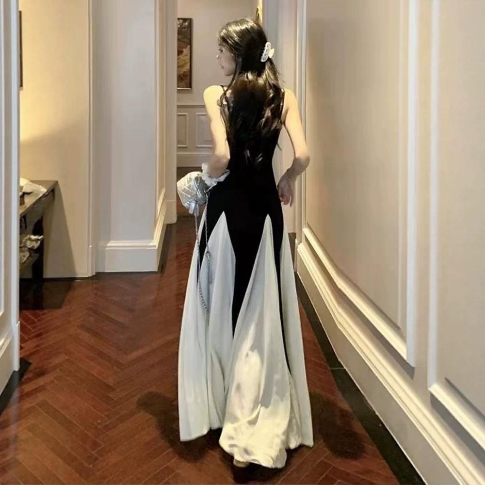 French high-end black and white splicing suspender dress Hepburn style beautiful unique temperament waist a word long dress summer