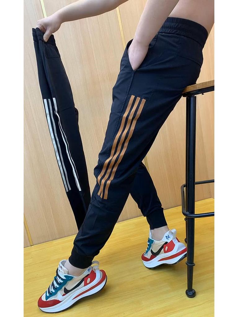Men's Stylish Ice Silk Quick-Dry Harem Pants - Spliced, Fashionable, Versatile, and Trendy for Spring and Summer.