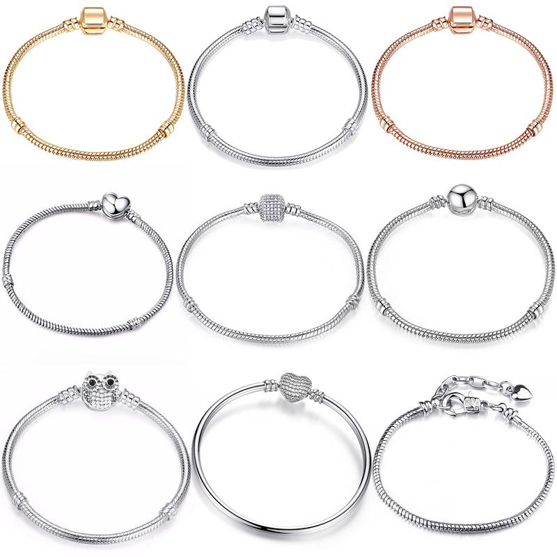 Eenvoudig zelf te maken slangenkettingarmband met Europese bedeltjes, een modieuze sieradenstijl voor dames, zoals die van Mary Poppins.