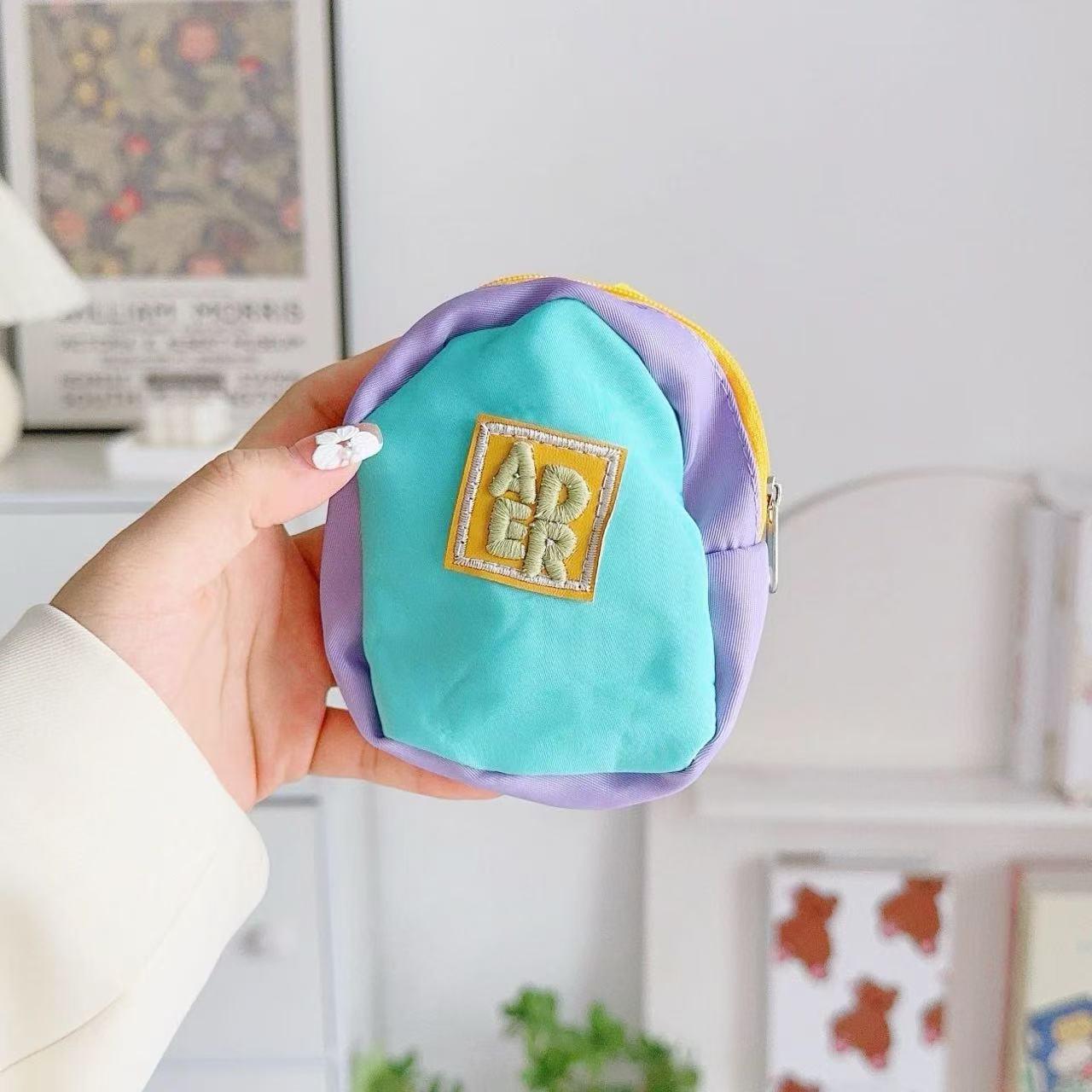 

Xiaohongshu Dopamine Mini Backpack Pendant: Lipstick Coin Purse, Soft Phone Case, Hanging Storage Bag.