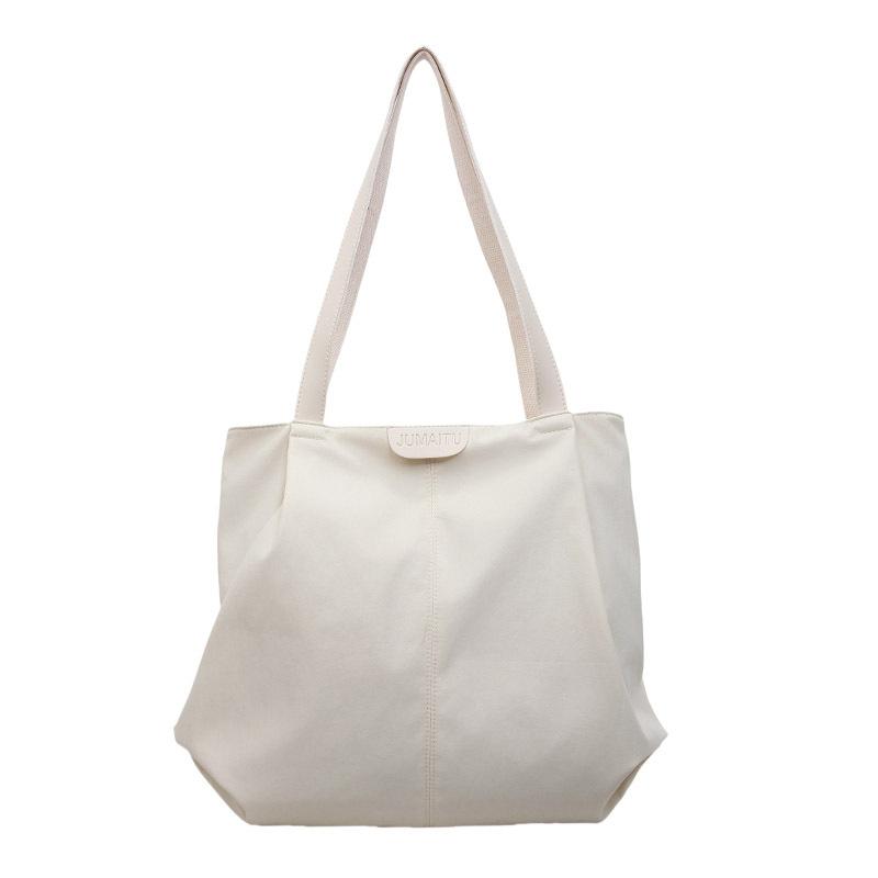 2025 spring and summer large-capacity canvas bag women's casual shoulder bag simple contrasting color versatile niche tote bag