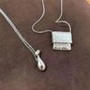 Habl Blogger-Style Water Purifier Pendant Necklace: Versatile Women's Accessory, Ideal for Layering with Sweaters.