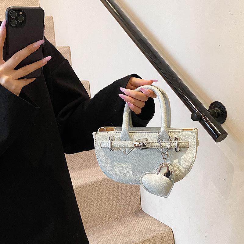 

New women s bag fashionable and versatile platinum bag solid color portable shoulder oblique span bag синий