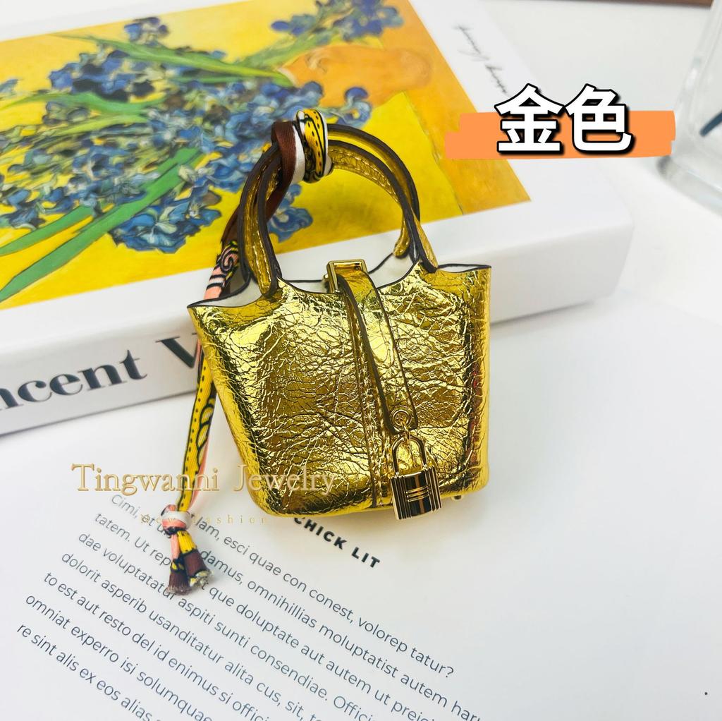 Neuer Mode-Taschenanhänger, hochwertiger Leder-Autoschlüsselanhänger, niedliche kreative Kopfhörertasche, Schmuck für Damenhandtaschen.