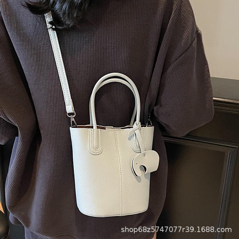 Korean simple style portable bucket bag women's 2025 summer new fashionable and popular one-shoulder crossbody vegetable basket bag
