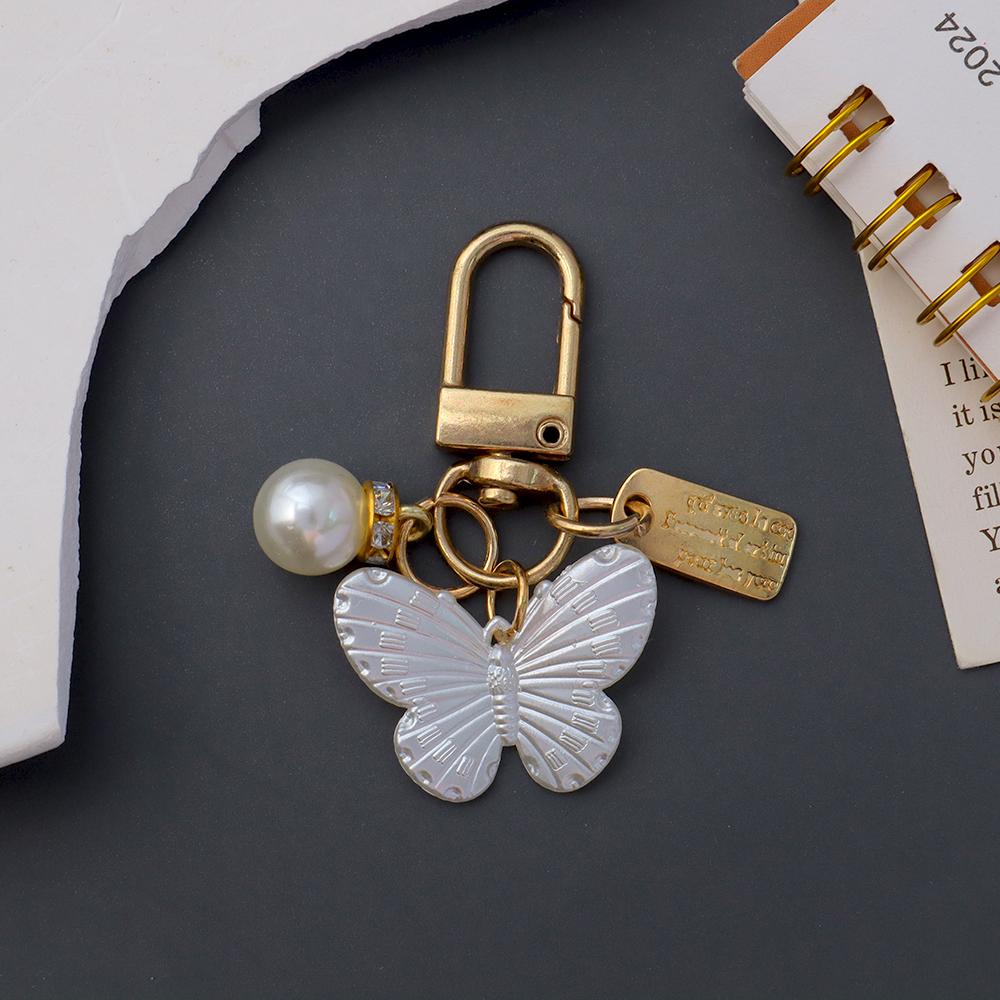 Niedlicher Perlenblumen-Schlüsselanhänger Glänzendes Muschelblatt-Schlüsselanhänger Metallanhänger Zubehör für Damen Auto Anhänger Taschenanhänger Schmuck