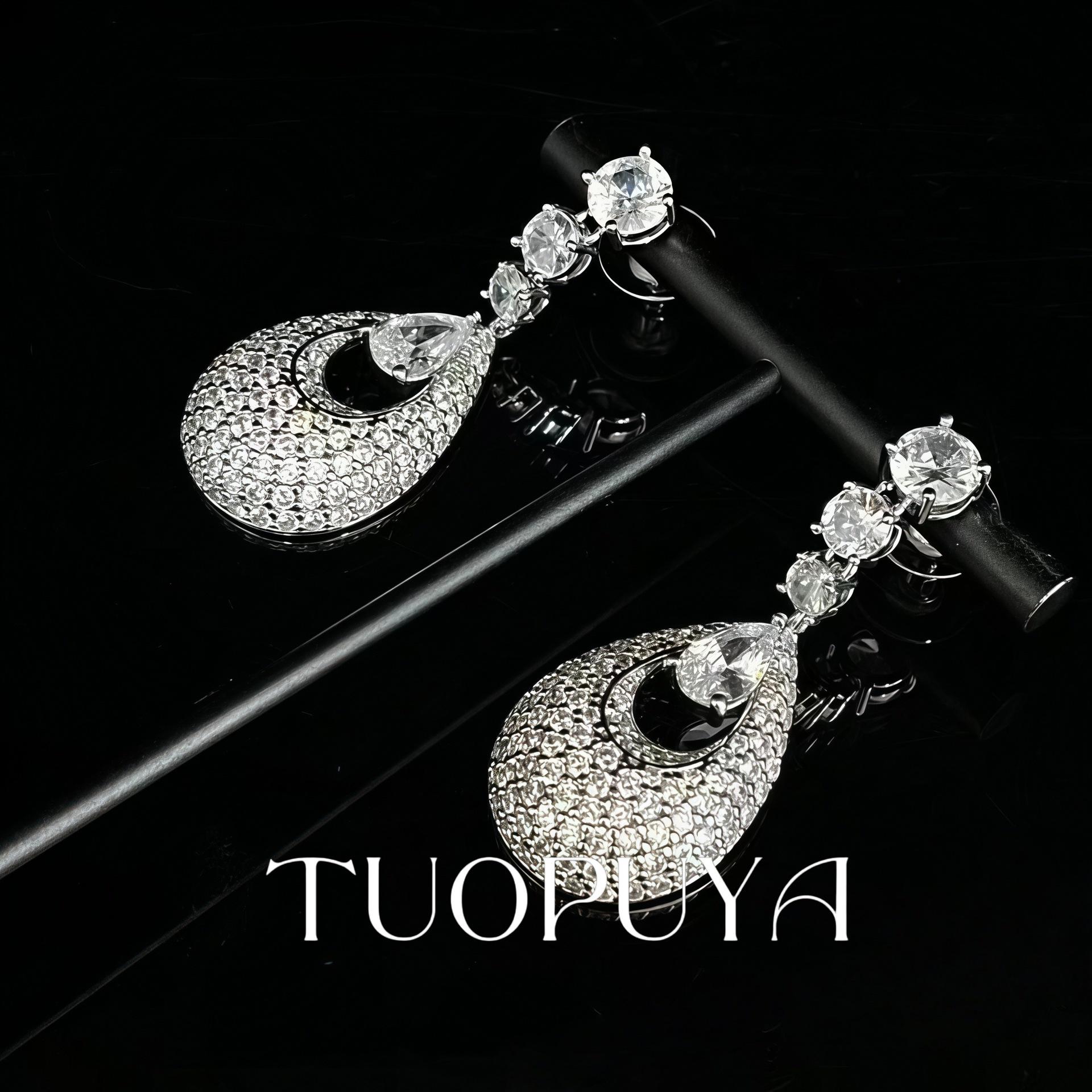 Elegant Rhinestone Teardrop Earrings with Zircon Studs, Hypoallergenic Silver Needle Design.